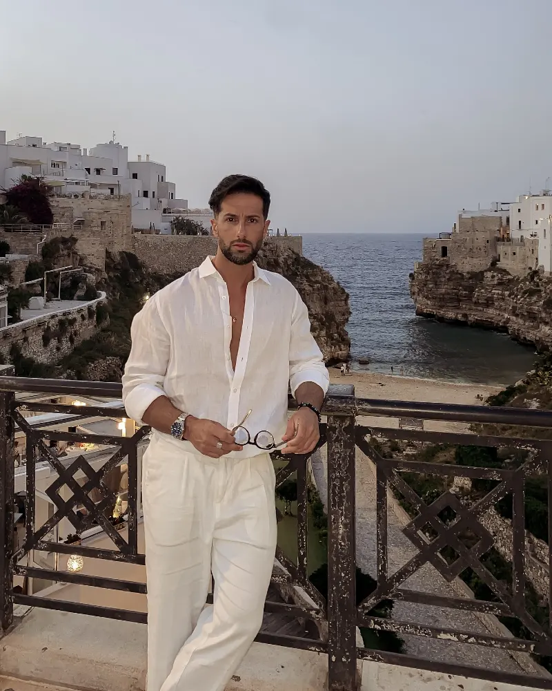 White Linen Shirt with Pleated White Trousers and Metal Hardware