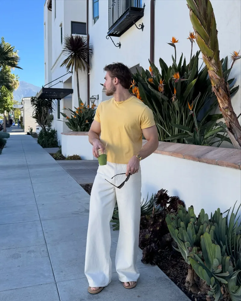 Yellow T-Shirt with Wide White Denim and Brown Sandals